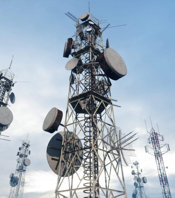 Close-up View Of Antenna Towers With Blue Sky Background